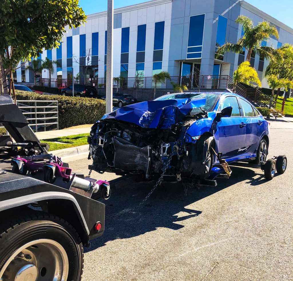 Car being towed as result of accident