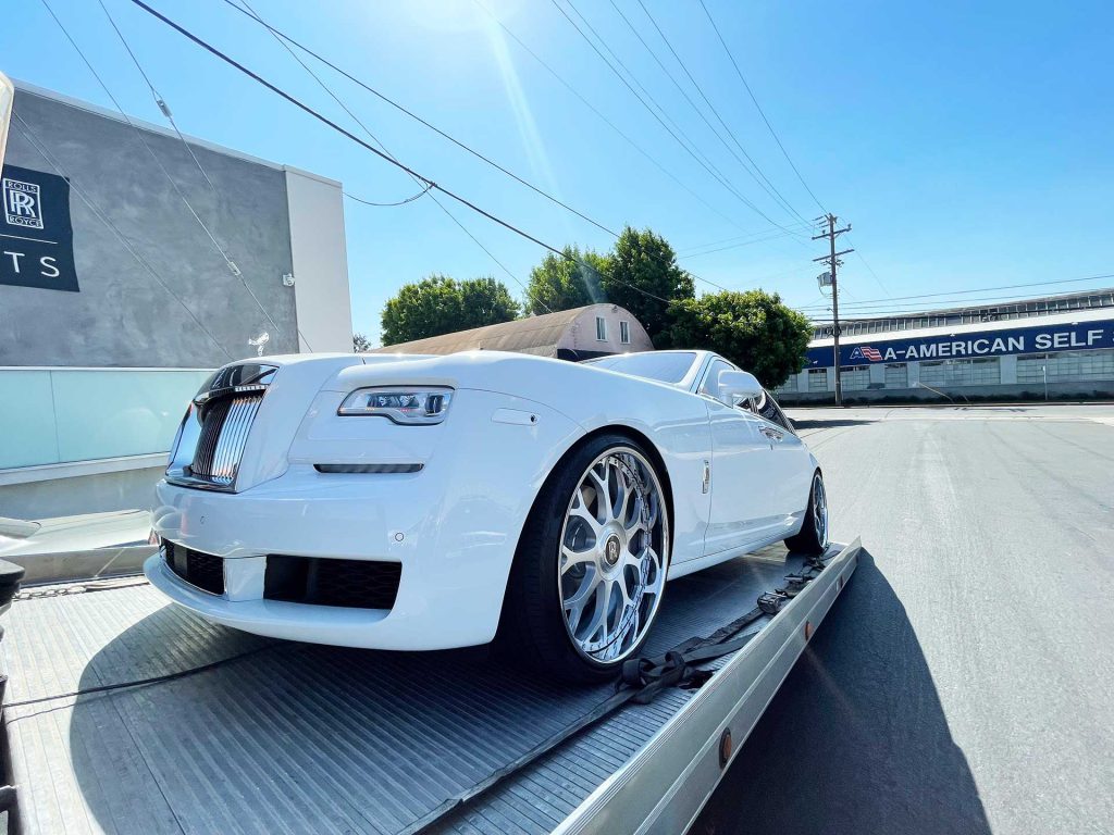 Rolls Royce being towed to the dealership